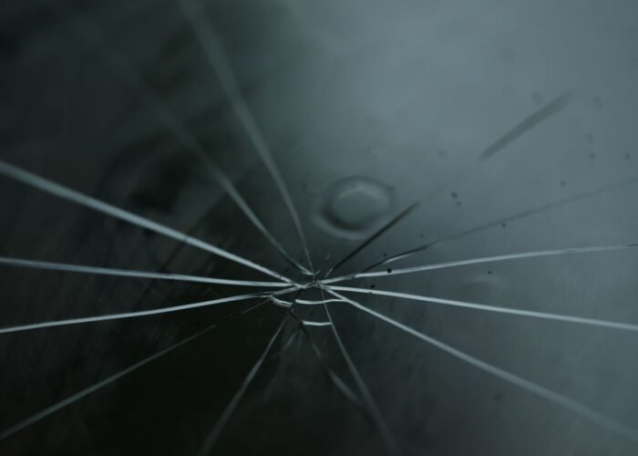Cracked windshield on a car in Pittsburgh, PA that may need repair or replacement